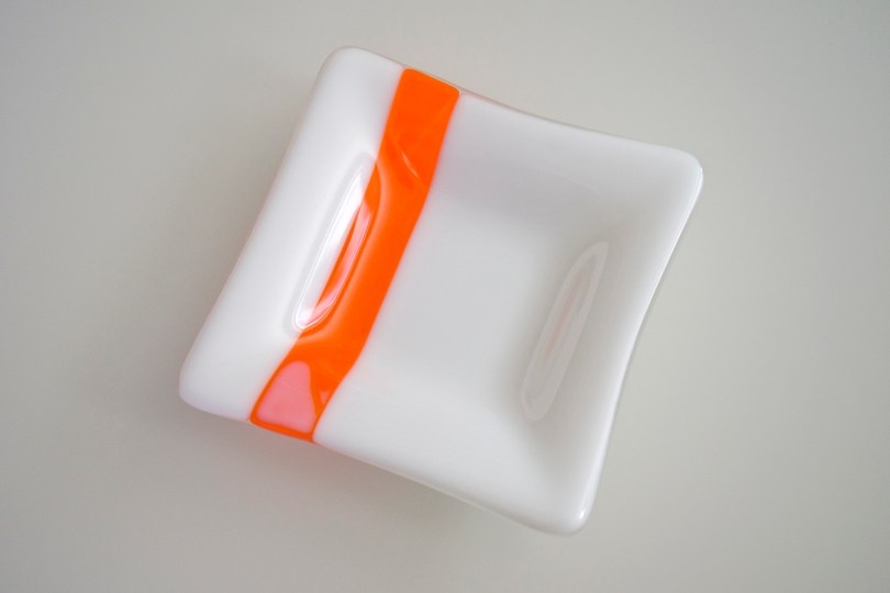 White with orange square dish