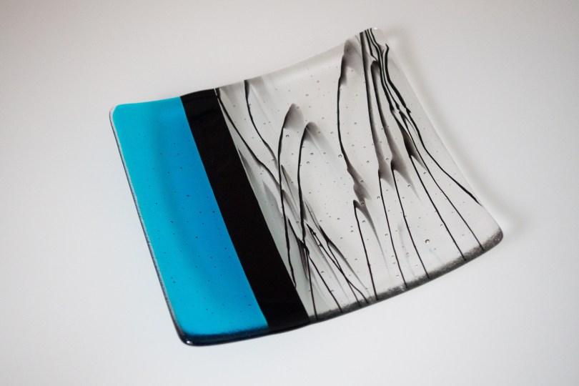 8" aqua plate with black drizzle