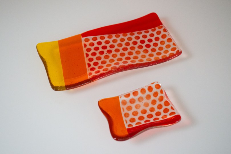 Set of orange polka dot plates